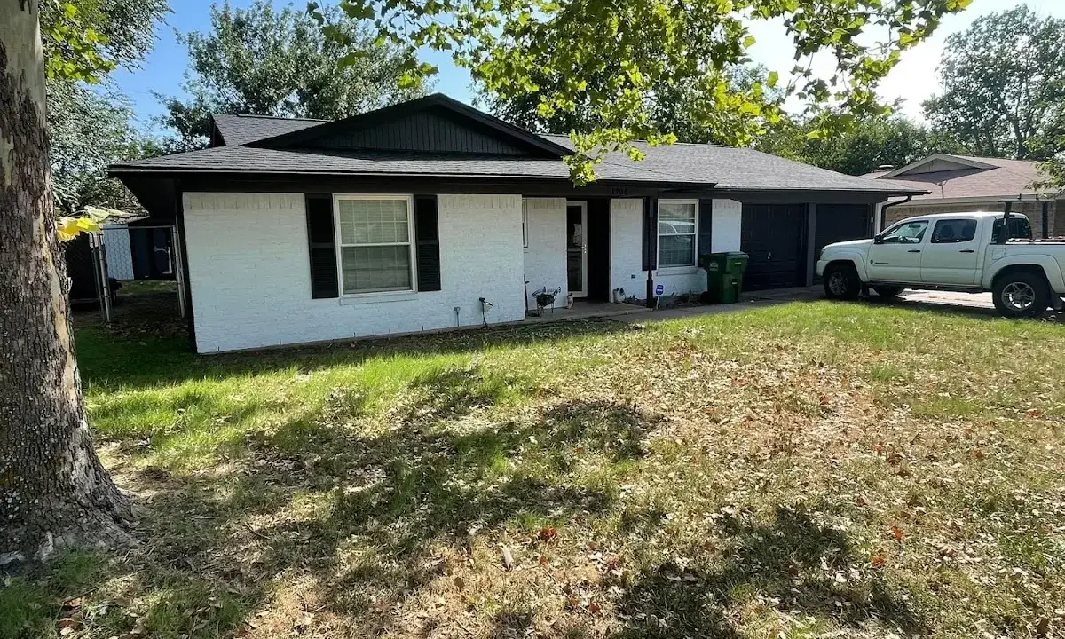 Professional roofing crew working on a residential roof in Oak Hills
